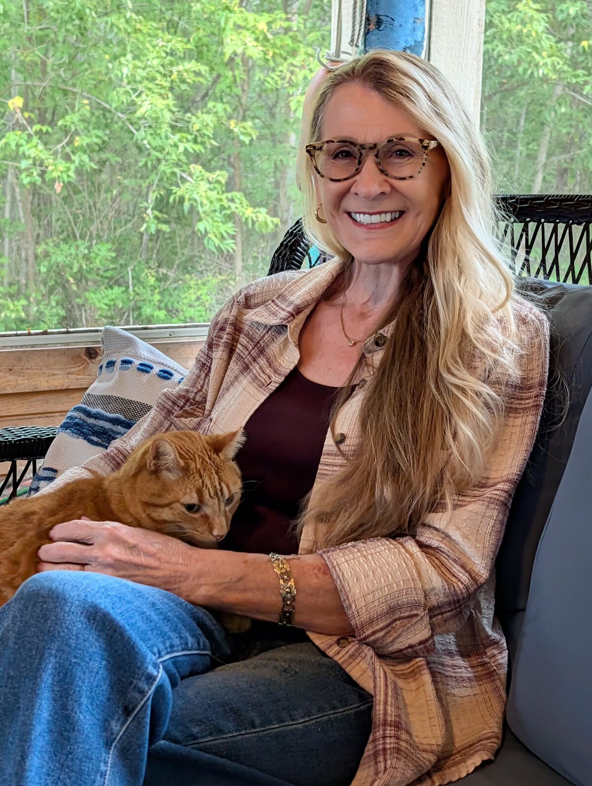 Michelle Lee relaxing at home with a cat